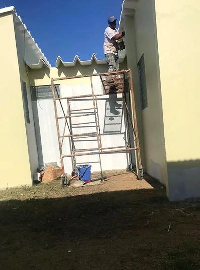 Exterior painting on scaffolding